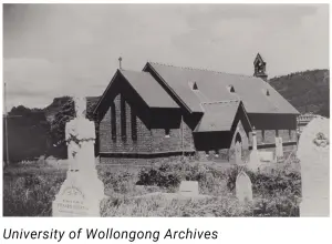 Black and white photo of St Augustine's Church, Bulli, in the 1890s, with gravestones in the foreground (University of Wollongong Archives)